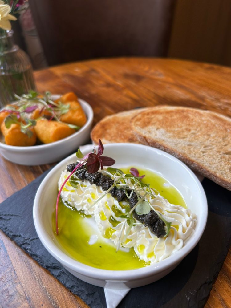 Toasted sourdough bread, whipped ricotta, black olive tapenade, spinach and basil oil